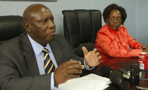 Energy and Power Development Minister Dr Samuel Udenge addresses journalists on fuel prices while his deputy Tsitsi Muzenda listens in Harare yesterday. — Picture by Regis Nyandima