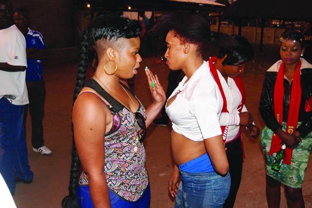 Jean Masters (L) and Beverly ‘Bev” Sibanda chat as Revai Tinarwo (in red scarf) approaches