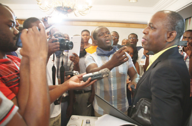 Journalists mob Econet lawyer Tawanda Nyambirai after an aborted Press briefing