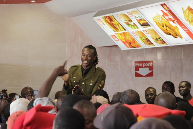 File Photo: Fans stampeding towards Jah Prayzah as he graced a Chicken Slice opening