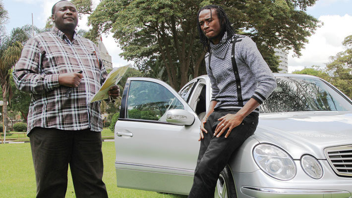 Esau Mupfumi seen here handing over a Mercedes to singer Jah Prayzah (Pic by NewsDay)