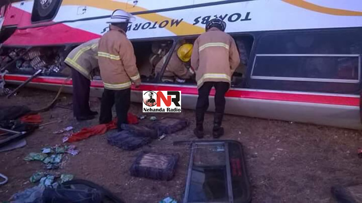 Members of the Fire Brigade try to rescue trapped passengers