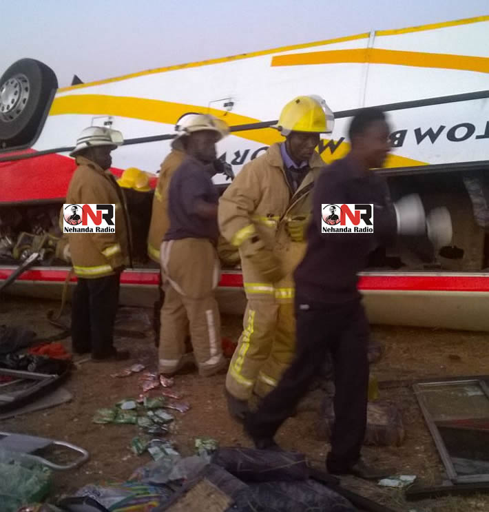Members of the Fire Brigade try to rescue trapped passengers