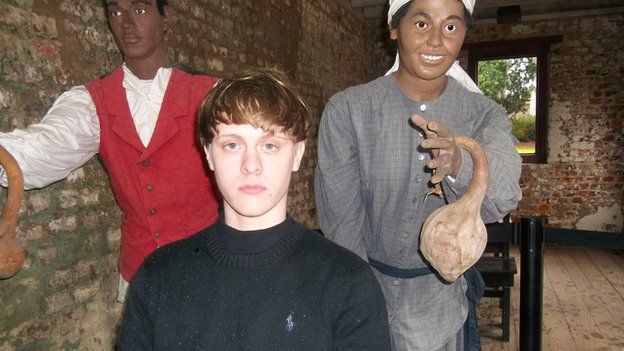 The 21-year-old was also seen posing with wax reproductions of slaves