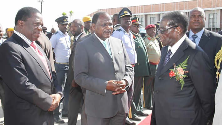 Vice President Emmerson Mnangagwa (left) sees off President Mugabe at the airport