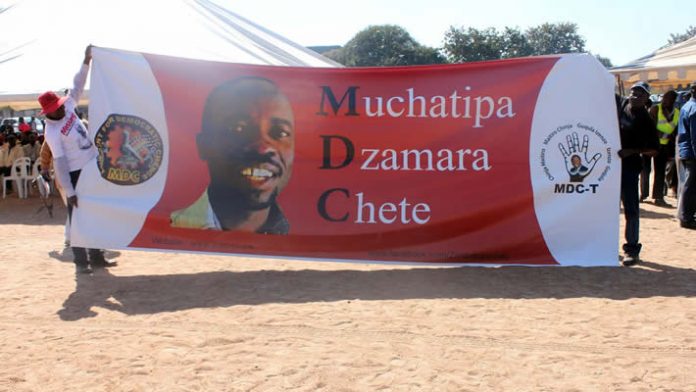 Banner demanding the release of Itai Dzamara