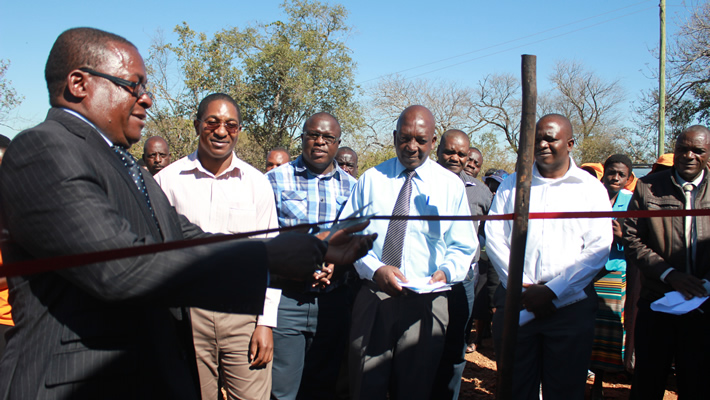 Kudakwashe Bhasikiti when he was still Masvingo Provincial Affairs Minister seen here handing over an Oxfam donated water purification system to the Civil Protection Unit meant for the people of Chingwizi temporary settlement area. (Picture by Oxfam)