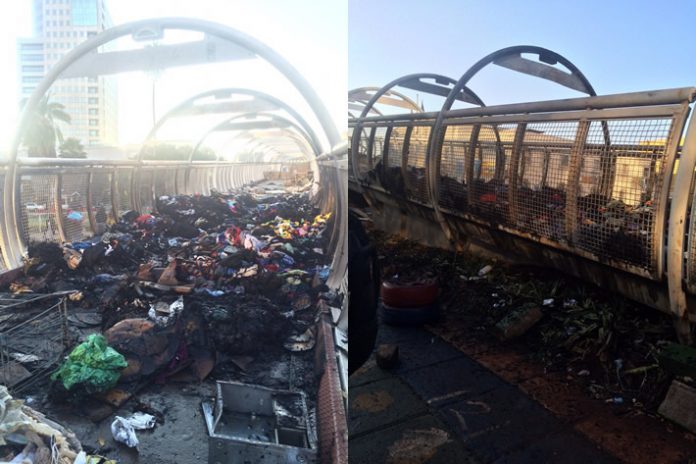 Municipal police burn vendors clothing bales