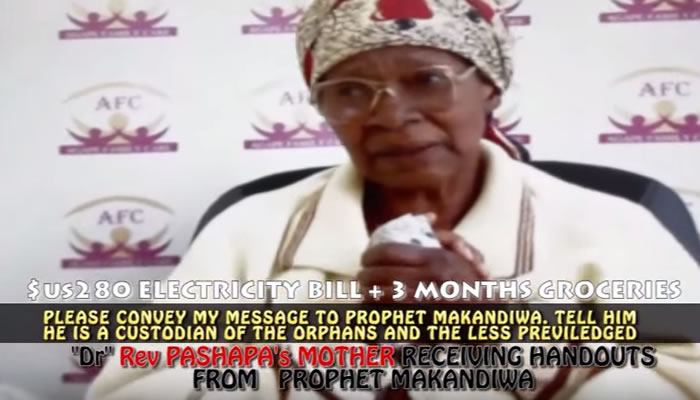 Gogo Miriam Pashapa receiving handouts from Emmanuel Makandiwa's church