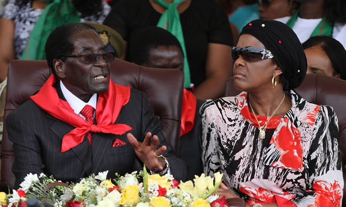 Zimbabwe's president Robert Mugabe celebrates his 91st birthday with his wife Grace in February 2015.
