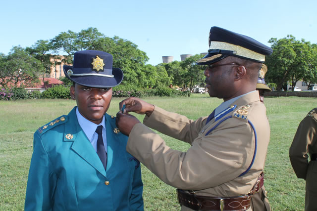 Asst Comm Stephen Mutamba (officer commanding police in Bulawayo province) (right) is said to be leading the victimisation of Samuel Kufandada