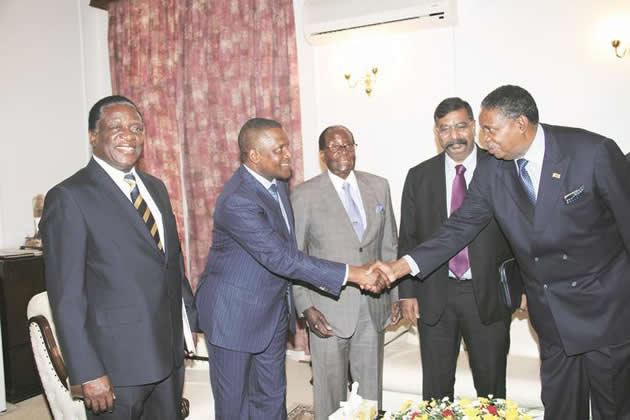 President Mugabe (centre) introduces Africa`s richest man Mr Aliko Dangote (second from left) to Vice President Phelekezela Mphoko (extreme right), while Vice President Emmerson Mnangagwa (left) and Dangote Group executive director Mr Edwin Derakumur Victor (second from right), look on at State House in Harare yesterday. — (Picture by Innocent Makawa)