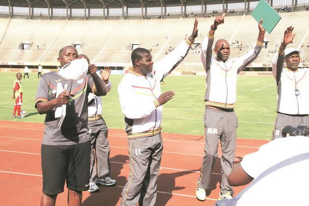 FALSE START . . . CAPS United’s new coach Lloyd Chitembwe (second from left) and his assistants (from left) Fungai Tostao Kwashi, Mark Mathe and Brenna Msiska greet their fans before the start of yesterday’s goalless draw against Buffaloes at the National Sports Stadium yesterday