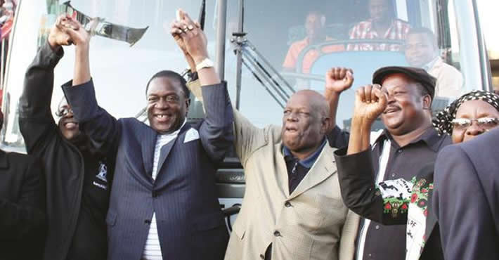 FILE PICTURE: Then Vice-President Emmerson Mnangagwa congratulates Highlanders Football Club chairman Peter Dube (second from left) and Retired Colonel Tshinga Dube (centre) at the commissioning of the club’s bus at Barbourfields Stadium in Bulawayo. Among those who witnessed the event are the Bulawayo Metropolitan Province Minister of State Nomthandazo Eunice Moyo (left), Minister of Sports, Arts and Culture Andrew Langa and Minister of Small and Medium Enterprises and Co-operative Development Sithembiso Nyoni
