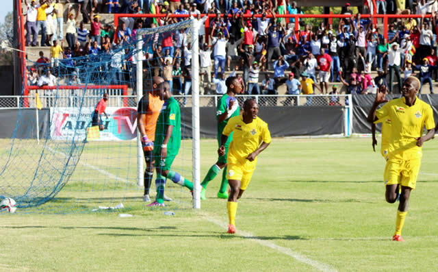 Zimbabwe skipper Danny Phiri celebrates his goal against Lesotho with Teenage Hadebe