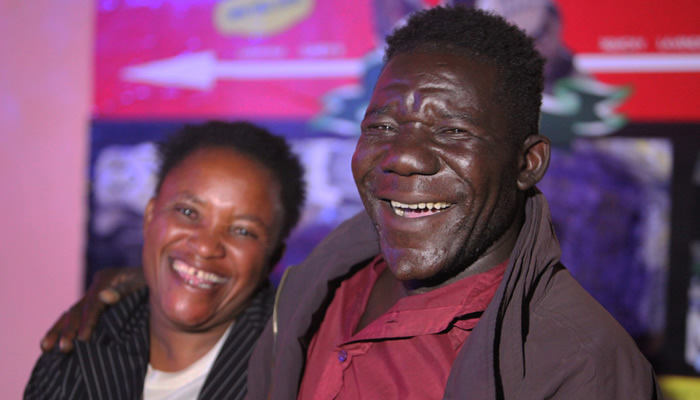 William Masvinu (R), winner of Zimbabwe's 2012 "Mr. Ugly" pageant, poses with his wife, Alice Chabhanga. Chabhanga says she was attracted to Masvinu because of his cheerfulness, kindness, and sense of humor.