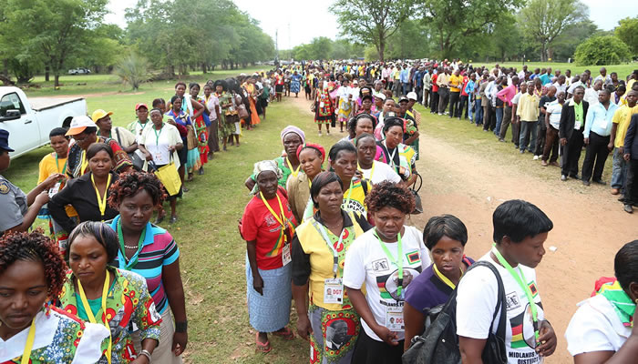 Zanu PF delegates go through security checks at the conference venue