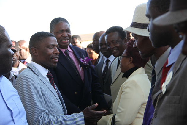 Dexter Nduna (left) seen here at David Whitehead Textiles in Chegutu with then Vice President Phelekezela Mphoko