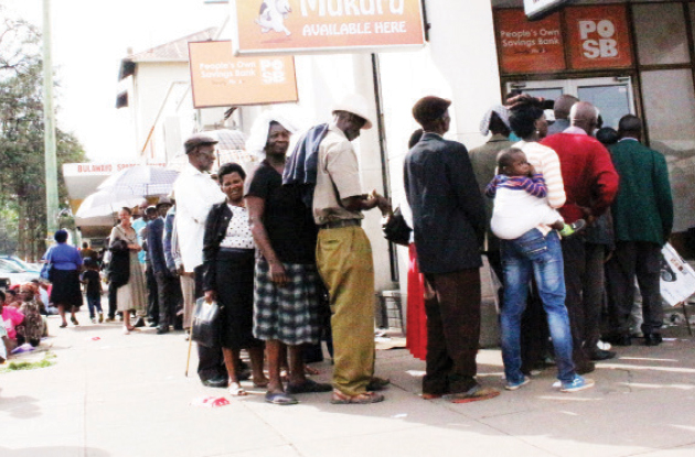 Pensioners queue to withdraw their cash at a Bulawayo bank yesterday