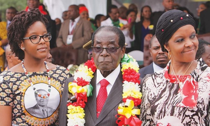 President Robert Mugabe flanked by his daughter Bona and wife Grace