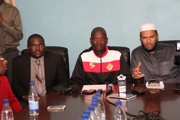 Warriors’ team manager Sharrif Mussa (right) fields a question from journalists while coach Callisto Pasuwa (centre) and ZIFA spokesman Xolisani Gwesela listen during the media conference in Harare yesterday where the men to represent the country at the 2016 CHAN finals were named