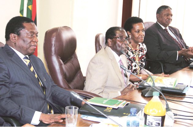 File picture of President Robert Mugabe addressing the Zanu PF politiburo while flanked by his wife and the two Vice Presidents Emmerson Mnangagwa (left) and Phelekezela Mphoko (right)