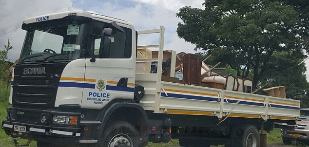Dumped: The Rankins' belongings were piled onto a police vehicle and driven away as part of the eviction