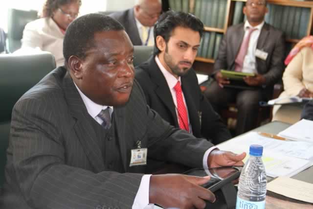 Civil Aviation Authority of Zimbabwe CEO Mr David Chawota (left) addresses the Parliamentary Portfolio