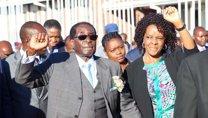 President Mugabe and First Lady Amai Grace Mugabe acknowledge multitudes of people who were gathered at the Harare International Airport to welcome him from Japan. – Picture: Believe Nyakudjara