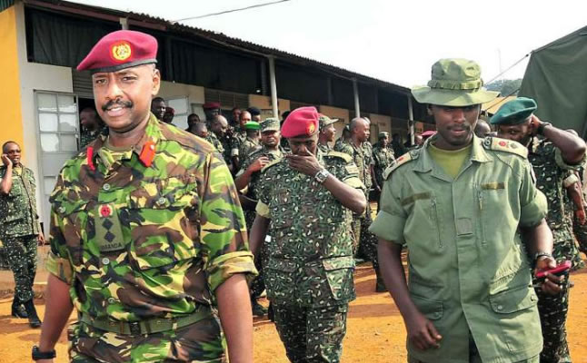 Kainerugaba Muhoozi, on the left, is seen as the most powerful person in the army