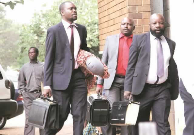 Munyaradzi Kereke (right) arrives for his trial at the Harare Magistrates courts