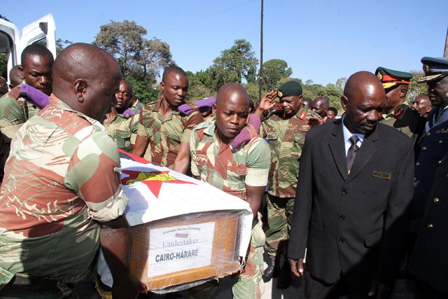 imbabwe Defence Forces commander General Constantine Chiwenga honours the body of Rtd Brig-Gen Muchemwa’s upon arrival at One Commando barracks while Zimbabwe National Army commander Lieutenant-General Philip Valerio Sibanda (partly obscured) and Air Force of Zimbabwe commander Air Marshal Perence Shiri look on.