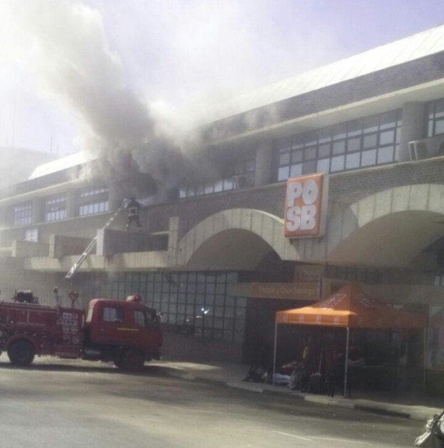 Plumes of smoke coming out of the building