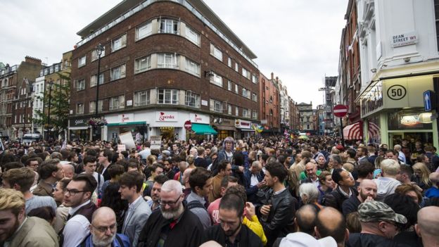 The vigil in London brought crowds on to the streets of Soho