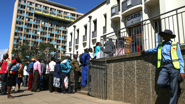 Zimbabweans queue at banks