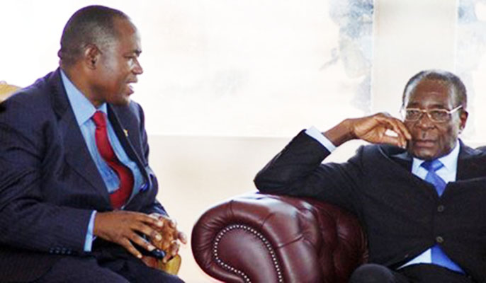 File picture of Gideon Gono seen here with with President Robert Mugabe