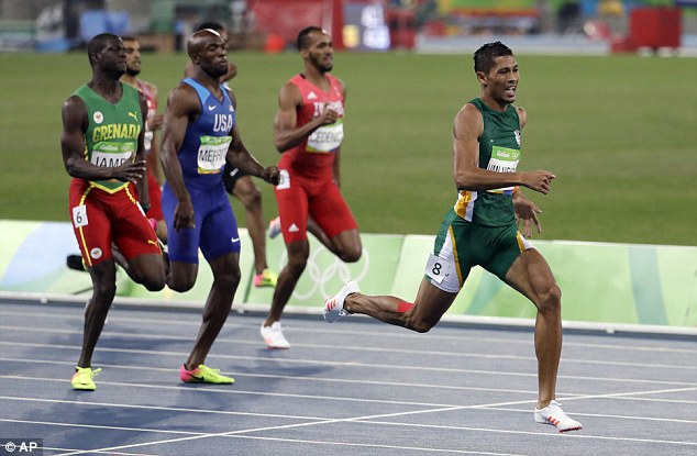 Winner: van Niekerk lit up the Maracana on Friday where he smashed the 19-year world record