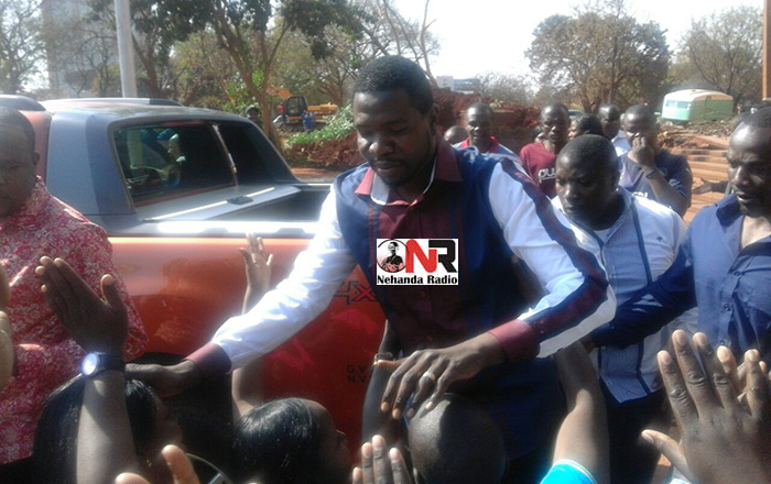 Prophet Walter Magaya greets his supporters outside the Harare Magistrates Court