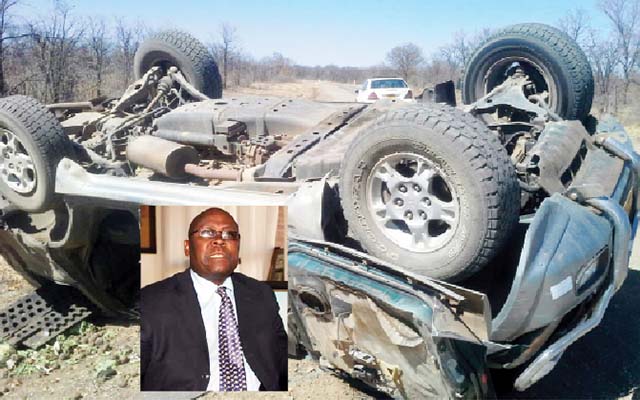 Minister Mathema (inset) and his car on its roof after the accident.
