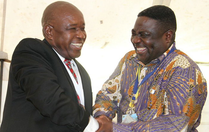 Christopher Mutsvagwa (left) is congratulated by presiding officer Major General Engelbert Rugeje after being nominated unopposed during the War Veterans Congress at Great Zimbabwe Hotel in Masvingo in November 2014 (Picture by Tawanda Mudimu)