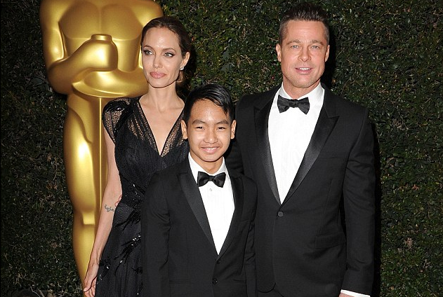 The incident is now 'under investigation by the FBI' but a source claims that the abuse allegations are ' exaggerated and fabricated ' (Maddox, Jolie and Pitt above in 2013)