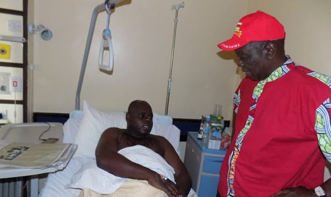 MDC leader, Morgan Tsvangirai visits Tajamuka spokesman, Silvanos Mudzvova in hospital.