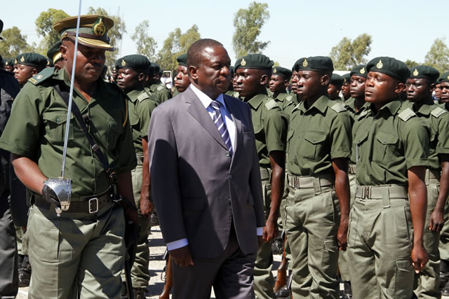 Minister of Justice, Legal and Parliamentary Affairs Emmerson Mnangagwa (now also Vice President) inspects a parade during a graduation ceremony at Ntabazinduna Prisons and Correctional Service Training School in 2014)