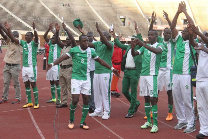 THE GREEN FAMILY . . . CAPS United defender Hardlife Zvirekwi (No.6) leads his teammates and members of the coaching staff in saluting fans after their dramatic comeback against bitter rivals Dynamos in a Castle Lager Premiership soccer match at the National Sports Stadium yesterday. — (Picture by Kudakwashe Hunda)