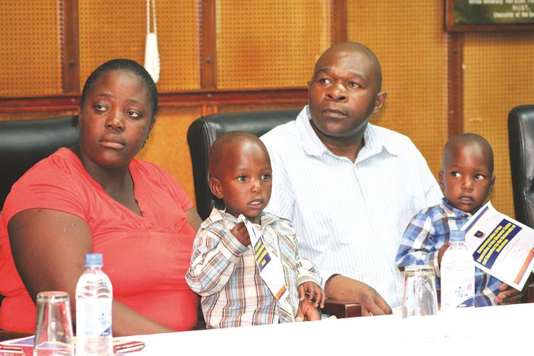 Mr Moses Chitiyo and wife Agnes with their history-making Siamese twins Kupakwashe (centre) and Tapuwanashe at a ceremony to commemorate the separation of the twins at the University of Zimbabwe in Harare last Friday. — Picture by Memory Mangombe