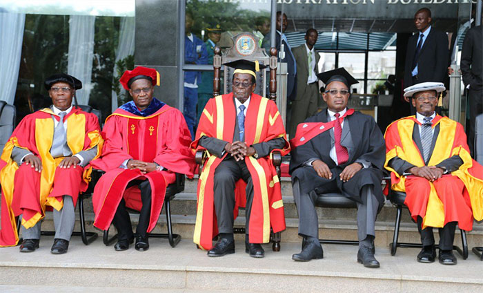 Jonathan Moyo (second left) and President Robert Mugabe (centre) at the NUST graduation ceremony in Bulawayo