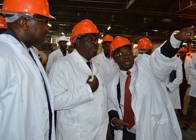 Turnall holdings Bulawayo factory's Acting Technical Executive Mr Godfrey Starch (third from left) show the Minister of Industry and Commerce Hon Mike Bimha (centre) their company's Newtech preparation plant during the Minister's tour of their factory at steeldale industrial sites yesterday, on the left is Turnall Board member Mr Manfred Mahari.....pic By Dennis Mudzamiri...