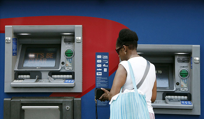 File picture of customer using an ATM