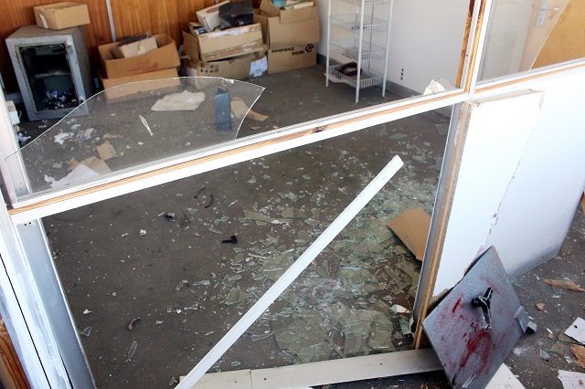 Robbers attacked MEGA PAK company and got away with cash after they forced open the safe using explosives. The picture shows shattered windows and safe (inside the office open).