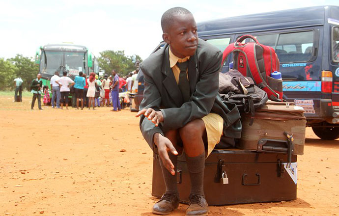 Pupil at Ngezi High School, Mhondoro waits for his parents after disembarking from a school bus at Civic Centre in Harare yesterday. – (Picture by Kudakwashe Hunda)